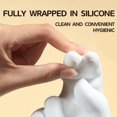 Close-up detail of Pellegrace adult sex toy being squeezed to show softness. Text reads 'Fully Wrapped in Silicone', highlighting the hygienic and body-safe material of this finger vibrator.
